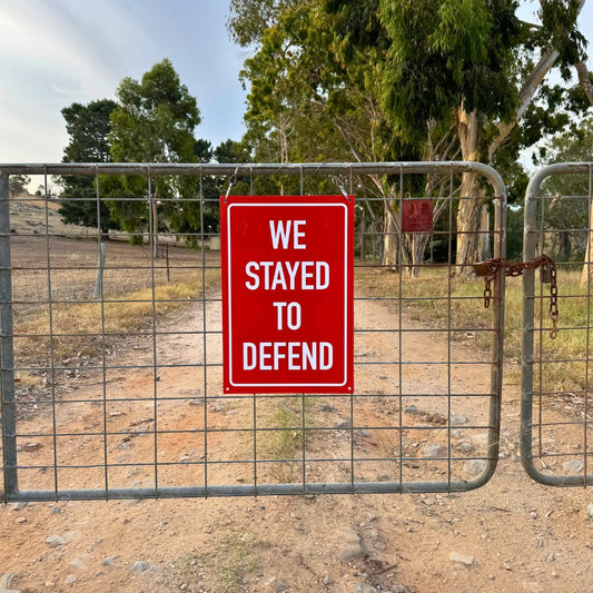 Reflective Sign - We Stayed to Defend